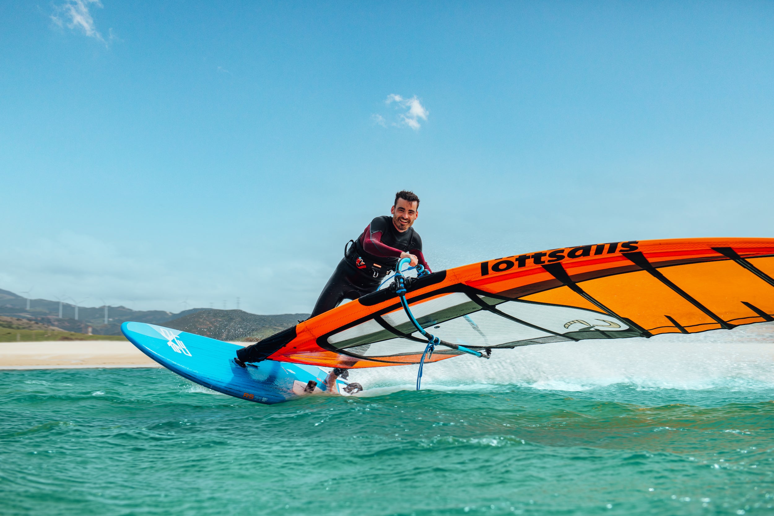 a windsurfer gybing on a Freeride board