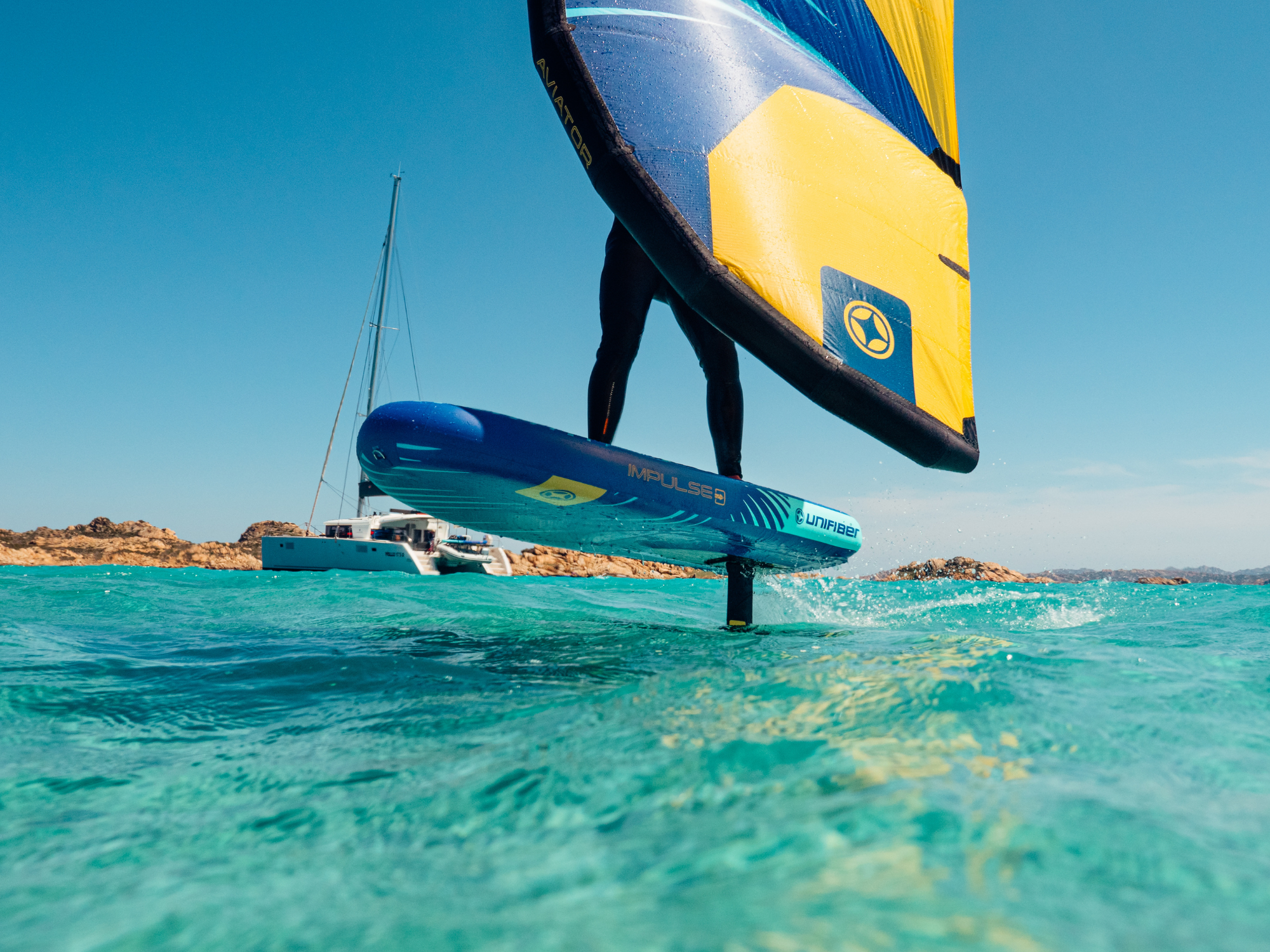 windsurfer in action sailing with unifiber foil and wing