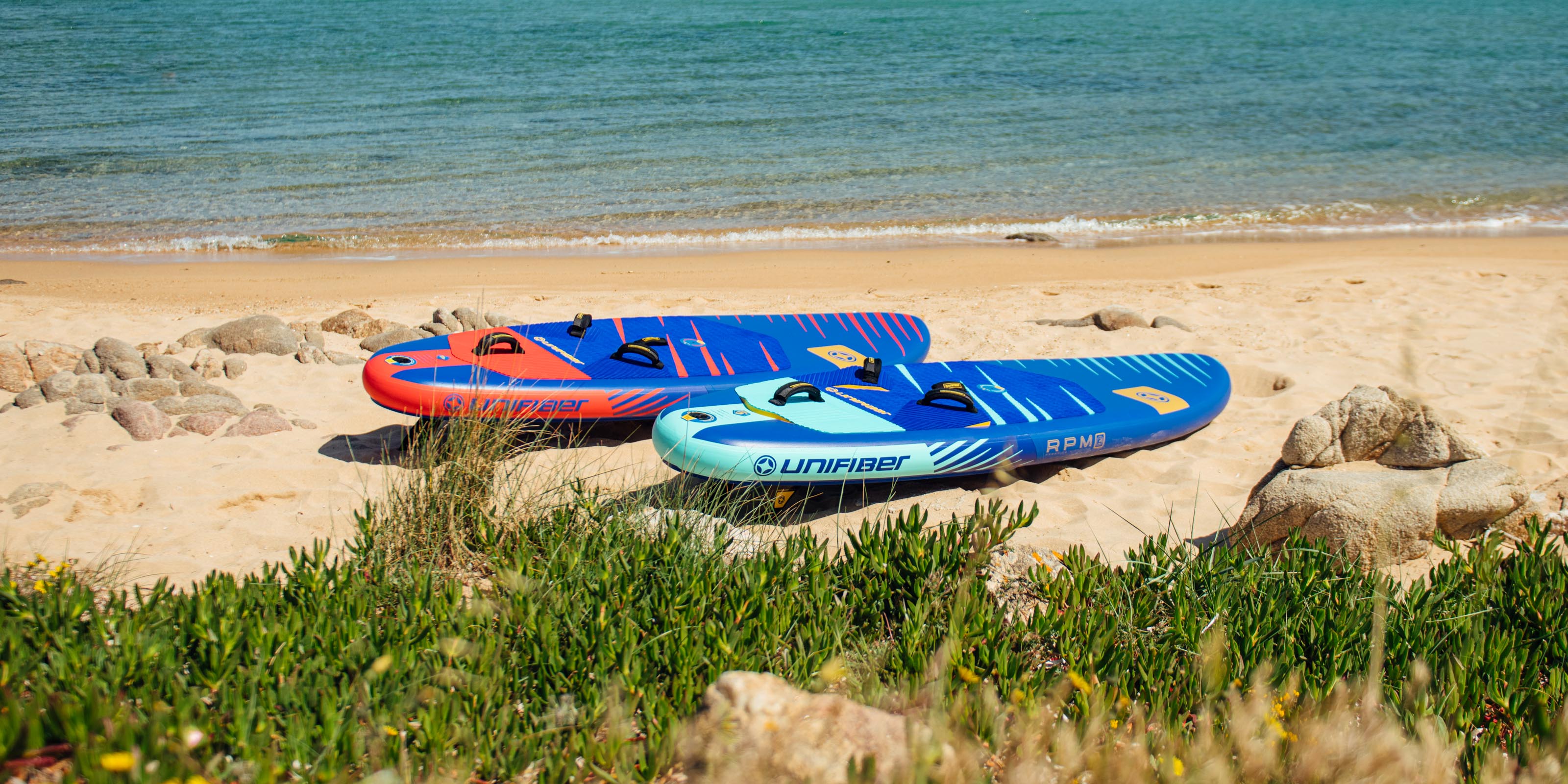 a windsurfer on an inflatable windsurf board cruising in flatwater