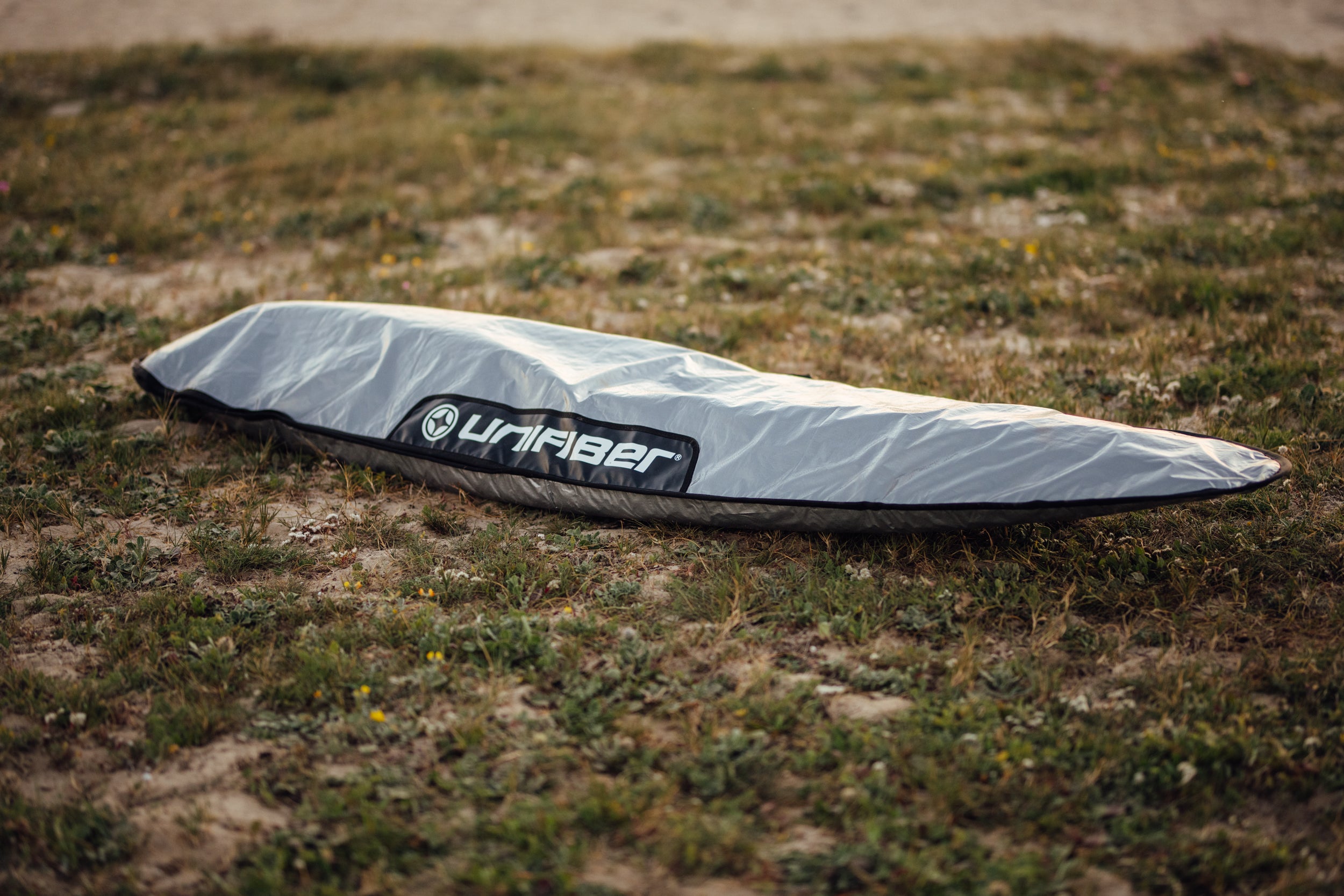 a windsurf boardbag made from reflective material to protect a windsurf board on the beach in Tarifa
